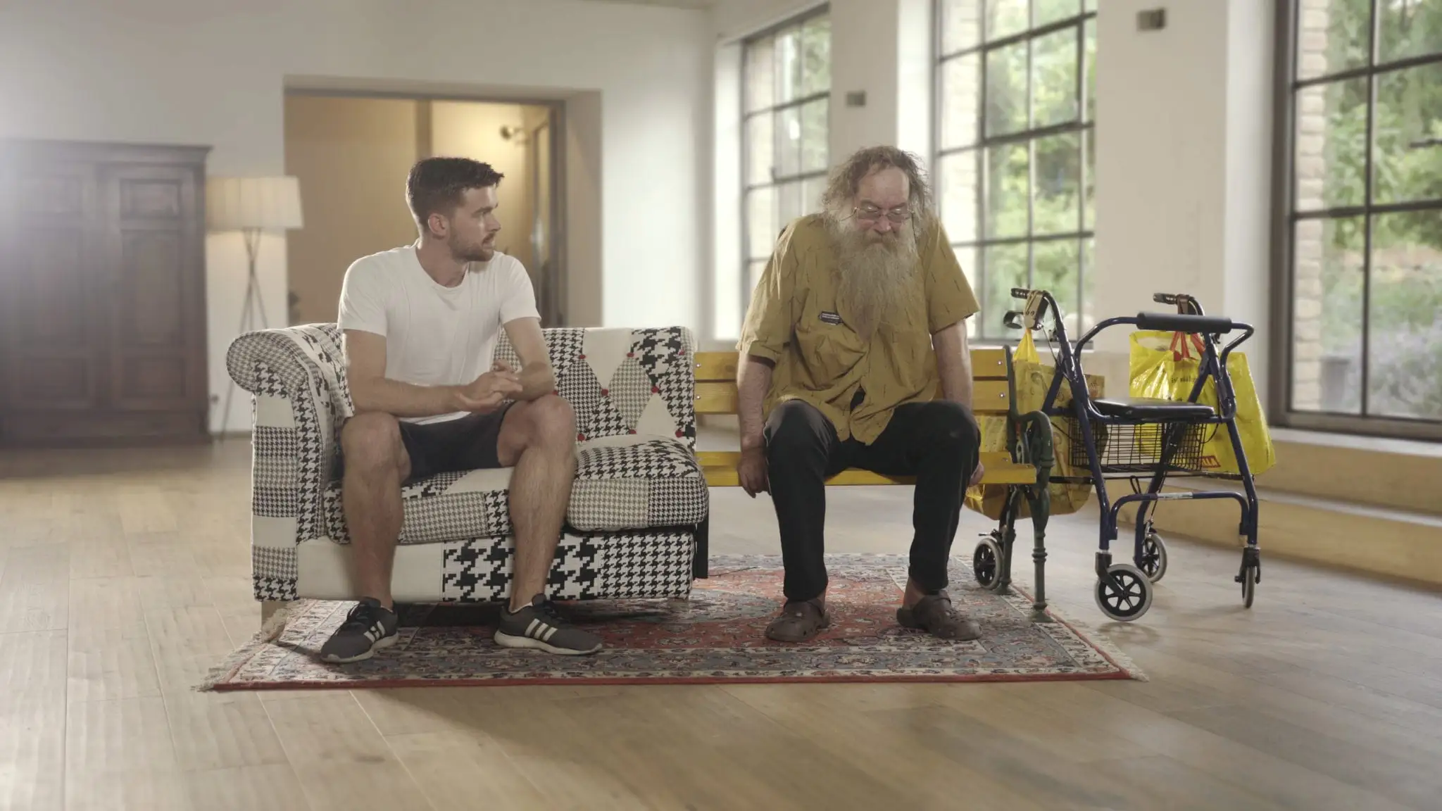 Strangers with opposing views, meeting on their merged sofa