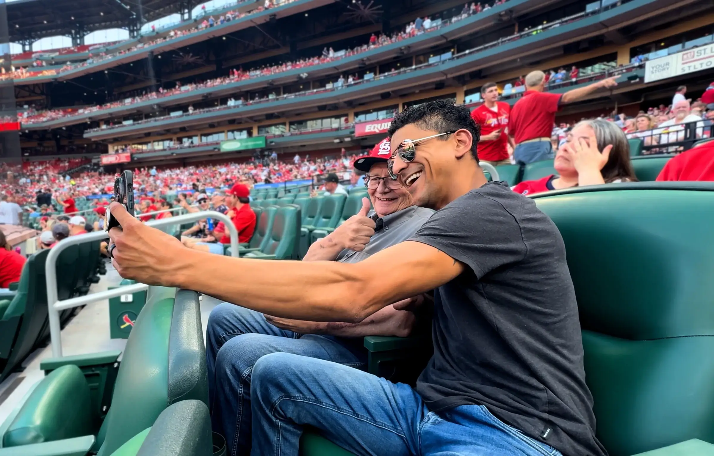 One participant takes a selfie with the stadium behind