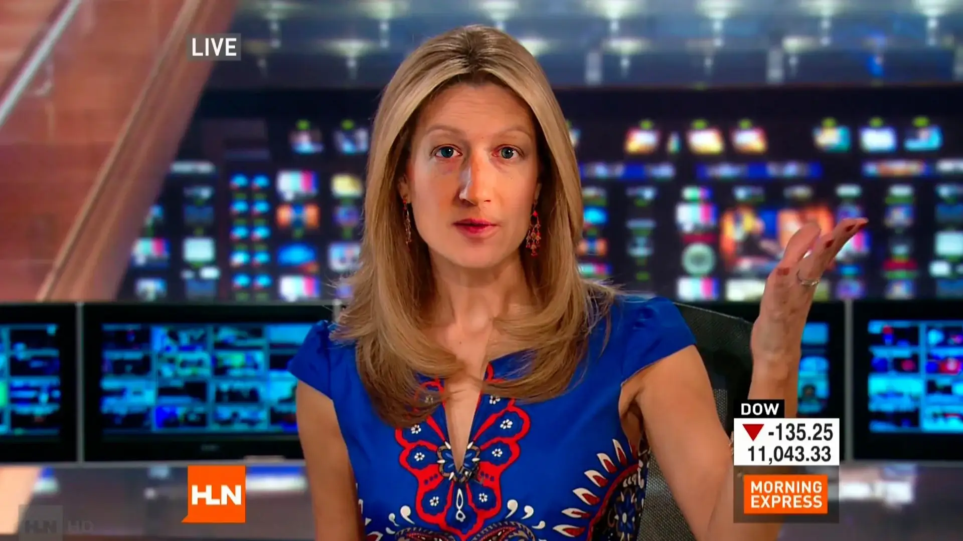 An HLN anchor mid-gesture, wearing Zuckerberg's face