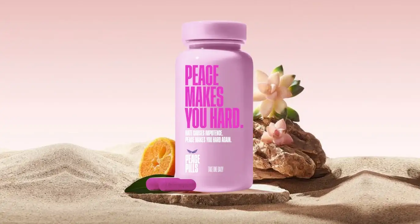 Pink 'Peace makes you hard' Peace Pills bottle on sand