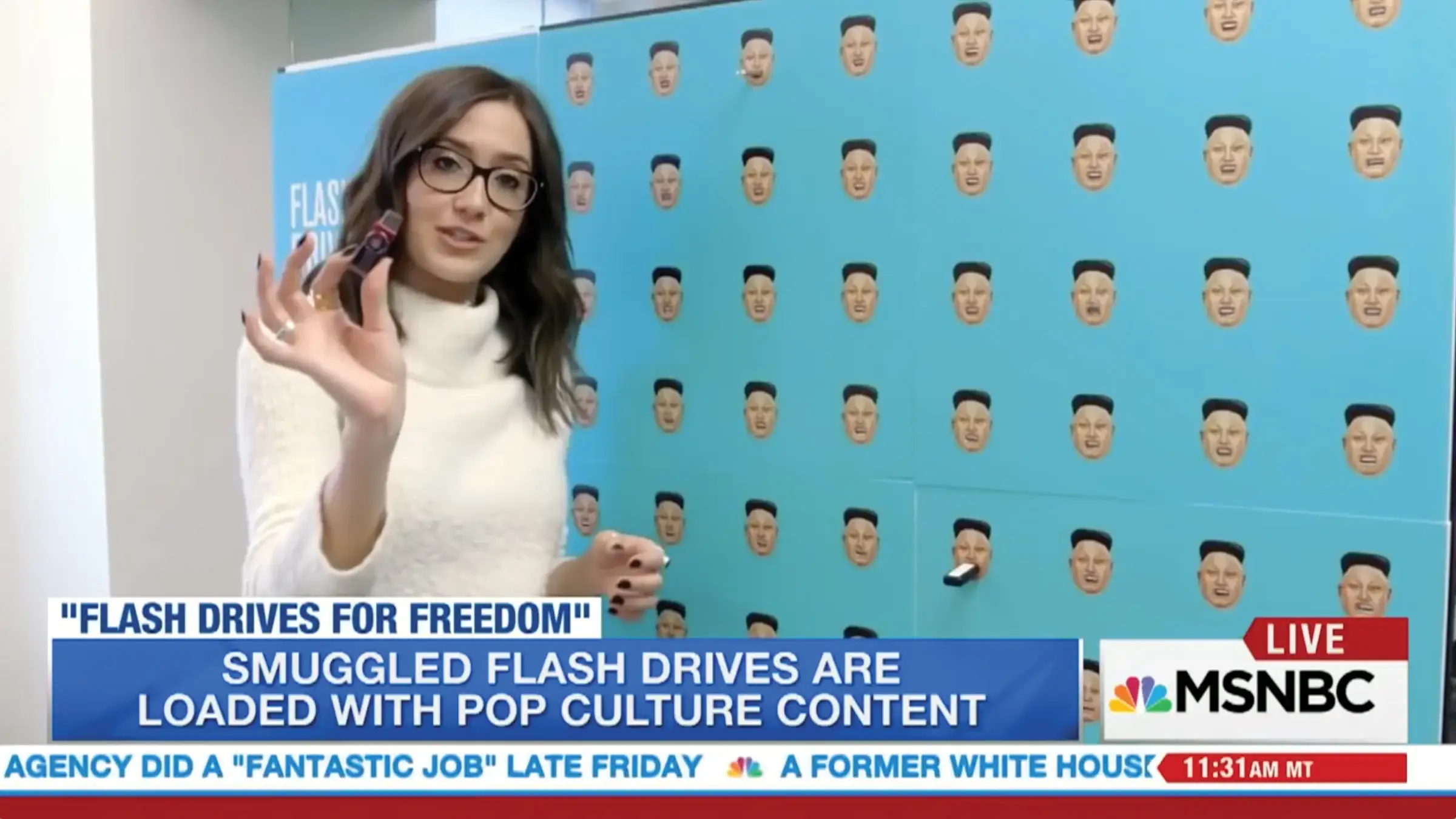 MSNBC reporting live in front of the installation (broadcast still)